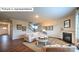 Open-concept living room featuring a fireplace, hardwood floors, comfortable seating, and natural light at 455 Zender Ln, Monroe, NC 28112