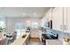 Bright, open kitchen with stainless steel appliances, granite countertops, and a view of the dining area and backyard at 5120 Fireweed Ct, Dallas, NC 28034