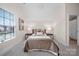 Bright bedroom with a large window, neutral decor, and a comfortable queen-sized bed at 516 Appomatox Dr, Waxhaw, NC 28173