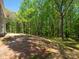 Expansive backyard offering privacy and natural beauty, backing up to a lush forest, ideal for outdoor enjoyment at 5311 Meadowland Pkwy, Monroe, NC 28112