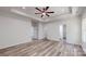 This bedroom has a ceiling fan and ensuite access to the bathroom at 5311 Meadowland Pkwy, Monroe, NC 28112