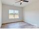 Serene bedroom offers abundant light through large window, and vinyl flooring at 5311 Meadowland Pkwy, Monroe, NC 28112