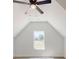 Bright bedroom features an attic ceiling and a view of the neighborhood at 5311 Meadowland Pkwy, Monroe, NC 28112