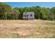 Gorgeous two-story home with a sprawling lawn, set in a serene and tranquil environment surrounded by trees at 5311 Meadowland Pkwy, Monroe, NC 28112