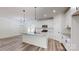 Modern kitchen with a large island, stainless steel appliances, and sleek countertops at 5311 Meadowland Pkwy, Monroe, NC 28112