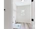 Bright laundry room boasts a window and convenient wire shelving at 5311 Meadowland Pkwy, Monroe, NC 28112