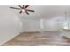 Spacious living area featuring a ceiling fan, wood floors, and bright natural lighting at 5311 Meadowland Pkwy, Monroe, NC 28112