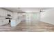 Spacious living area connecting to a modern kitchen with an island and stainless appliances at 5311 Meadowland Pkwy, Monroe, NC 28112