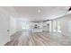 Open-concept living space with modern kitchen, island, and stylish flooring at 5311 Meadowland Pkwy, Monroe, NC 28112