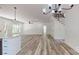 Spacious open-concept living space with plenty of natural light, a ceiling fan and wood-look flooring at 5311 Meadowland Pkwy, Monroe, NC 28112