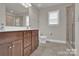 Bathroom with granite counters, cherry cabinets, and glass enclosed shower at 5417 Sustar Dr, Monroe, NC 28110