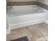 A closeup of the white porcelain bathtub in the bathroom of the home at 5417 Sustar Dr, Monroe, NC 28110