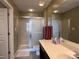 Bathroom showcasing a walk-in shower and a vanity with a large mirror at 5518 Prosperity View Dr, Charlotte, NC 28269
