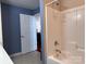 Shower stall featuring built-in shelving and accessibility handles at 5518 Prosperity View Dr, Charlotte, NC 28269