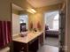 Bathroom featuring a large vanity, offering plenty of counter space and a peek at the bedroom at 5518 Prosperity View Dr, Charlotte, NC 28269