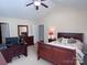 Bedroom boasting vaulted ceilings, a ceiling fan, natural lighting and a workspace at 5518 Prosperity View Dr, Charlotte, NC 28269