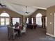 Spacious game room with pool table, seating, high ceilings, and large windows at 5518 Prosperity View Dr, Charlotte, NC 28269