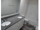 Bright bathroom with granite countertops, dual sinks, a tub, and white cabinets at 586 30Th Avenue Ne Cir, Hickory, NC 28601