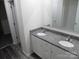 Bathroom featuring a double vanity with granite countertops and modern fixtures at 586 30Th Avenue Ne Cir, Hickory, NC 28601