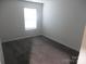 Cozy bedroom features neutral colored walls, carpeted floors and a window at 586 30Th Avenue Ne Cir, Hickory, NC 28601