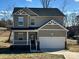 Charming two-story home with a welcoming front porch and a two-car garage at 586 30Th Avenue Ne Cir, Hickory, NC 28601