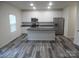 Modern kitchen with stainless steel appliances, granite countertops, and a large center island at 586 30Th Avenue Ne Cir, Hickory, NC 28601