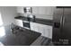 Kitchen with stainless steel refrigerator, stove, microwave, granite counter tops, and an island at 586 30Th Avenue Ne Cir, Hickory, NC 28601
