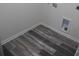 A bright laundry area with modern wood-look flooring and hookups for laundry appliances at 586 30Th Avenue Ne Cir, Hickory, NC 28601