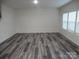 Bright living room with wood-look flooring, neutral walls, and plenty of natural light at 586 30Th Avenue Ne Cir, Hickory, NC 28601