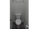 A cozy water closet with a modern toilet, gray flooring and chrome fixtures at 586 30Th Avenue Ne Cir, Hickory, NC 28601