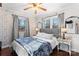 Charming bedroom with a plush bed, gray accents, and stylish decor at 693 Emerald Shores Rd, Mount Gilead, NC 27306