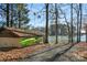 Lakeside boat storage building with two kayaks for convenient water access and recreation at 693 Emerald Shores Rd, Mount Gilead, NC 27306