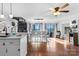 Spacious dining area with lake view, wood floors, a spiral staircase, and natural light at 693 Emerald Shores Rd, Mount Gilead, NC 27306