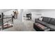 Comfortable living room with plush gray carpeting, a modern sofa, and a dedicated office space at 693 Emerald Shores Rd, Mount Gilead, NC 27306