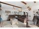 Spacious living room with beamed ceilings, hardwood floors, and an open layout at 693 Emerald Shores Rd, Mount Gilead, NC 27306