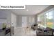 Cozy bedroom featuring plush seating, natural light, and neutral decor at 7027 Sylvan Retreat Dr, Denver, NC 28037