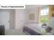 Cozy bedroom with neutral color palette, plush carpeting, and natural light from a large window at 7027 Sylvan Retreat Dr, Denver, NC 28037