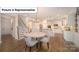 Open concept dining area featuring a modern chandelier and seamless transition to kitchen and living spaces at 7027 Sylvan Retreat Dr, Denver, NC 28037