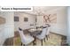 Elegant dining room featuring wainscoting, stylish chandelier, and modern decor at 7027 Sylvan Retreat Dr, Denver, NC 28037