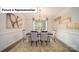 Formal dining room with modern chandelier, elegant wall coverings, and seating for six at 7027 Sylvan Retreat Dr, Denver, NC 28037
