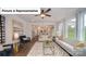 Inviting living room featuring hardwood floors, a ceiling fan, and an abundance of natural light at 7027 Sylvan Retreat Dr, Denver, NC 28037