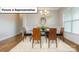 Formal dining room with modern decor, a stylish chandelier, and large bright windows at 7033 Sylvan Retreat Dr, Denver, NC 28037