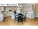 Bright kitchen with dining table, granite counters, stainless appliances and tile backsplash at 7033 Sylvan Retreat Dr, Denver, NC 28037