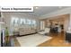 Bright living room featuring hardwood floors, large windows, and an open floor plan at 7033 Sylvan Retreat Dr, Denver, NC 28037