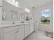 Bright bathroom with double sinks, large mirror, and stylish tile flooring at 7127 Chrysanthemum Rd, Lancaster, SC 29720
