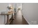 Bright hallway with hardwood floors, leading to various rooms, creating an open feel at 7127 Chrysanthemum Rd, Lancaster, SC 29720