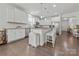 Spacious open-concept kitchen with granite countertops, stainless steel appliances, and an island with bar seating at 7127 Chrysanthemum Rd, Lancaster, SC 29720