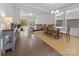 Bright, open-concept living and dining area with hardwood floors and natural light at 7127 Chrysanthemum Rd, Lancaster, SC 29720