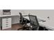 A bright, streamlined office space is well-equipped with dual workstations and minimalist storage at 7127 Chrysanthemum Rd, Lancaster, SC 29720