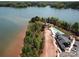 Stunning aerial view of new home, pool, and lake, offering a picturesque and luxurious lifestyle at 7459 Fighting Creek Rd # 33, Sherrills Ford, NC 28673